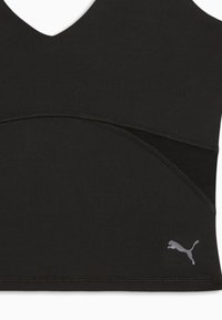 Μαύρο αμάνικο αθλητικό τοπ με πλέγμα λεπτομέρειας και μικρό ασημί λογότυπο Puma στην κάτω δεξιά πλευρά.