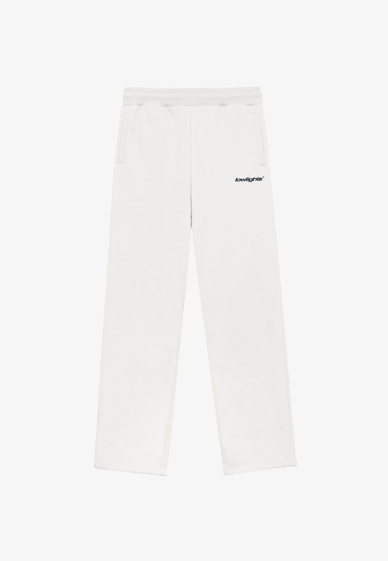 Pantalons de survêtement blancs avec une taille élastique et des poches latérales. Le nom de la marque "lowlights" est imprimé en marine sur la cuisse gauche.