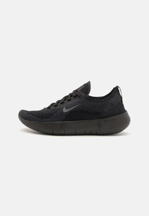 Black athletic shoe with a textured mesh upper, rounded toe, and a cushioned sole. Features a logo on the side and a pull tab at the heel.