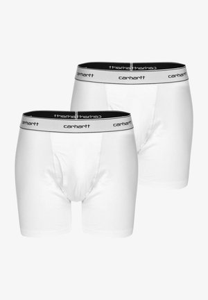 Boxer-briefs en coton blanc, avec une ceinture élastique noire portant le logo "Carhartt". Texture lisse, coupe standard et longueur mi-cuisse.