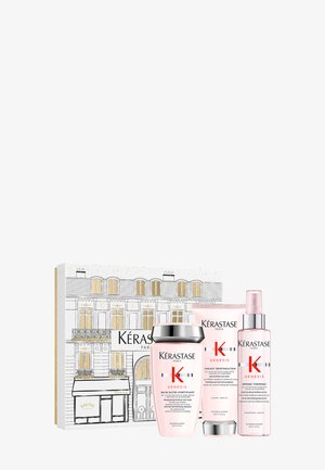 Zestaw prezentowy Kérastase Genesis zawiera trzy różowe produkty: szampon, odżywkę i spray do stylizacji, w ozdobnym pudełku z paryską ilustracją.