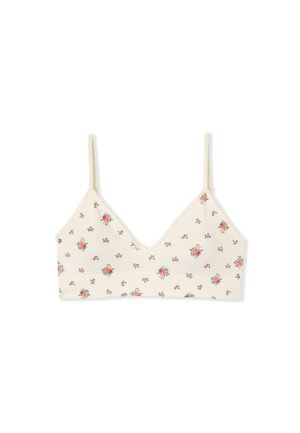 Cremefarbener Bralette mit dünnen Trägern, verziert mit kleinen roten und grünen Blumenmustern, die gleichmäßig über den Stoff verteilt sind.