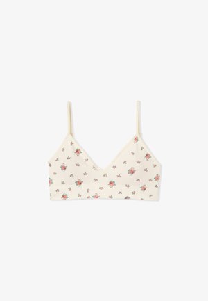 Cremefarbener Bralette mit dünnen Trägern, verziert mit kleinen roten und grünen Blumenmustern, die gleichmäßig über den Stoff verteilt sind.