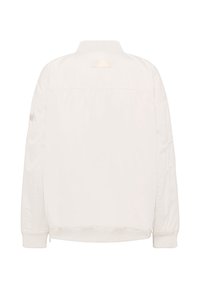 Giacca bomber leggera color avorio con polsini e vita a costine, cuciture visibili e una patch rettangolare vuota sulla parte superiore della schiena.