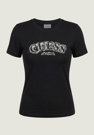T-shirt noir ajusté à manches courtes avec le texte blanc usé "GUESS California" sur la poitrine et un col rond.