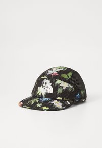 Blomstermønstret caps i sort, med meshpanel, flad skygge og hvidt logo. Lavet af letvægtsstof med tekstureret overflade.