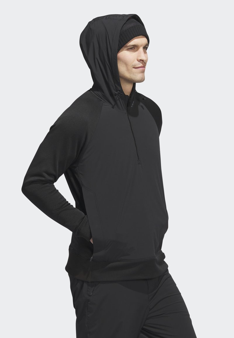 Schwarze Reißverschluss-Hoodie aus weichem Material, reguläre Passform, verstellbare Kapuze und lange Ärmel. Merkmale ein elegantes Design und Seitentaschen.