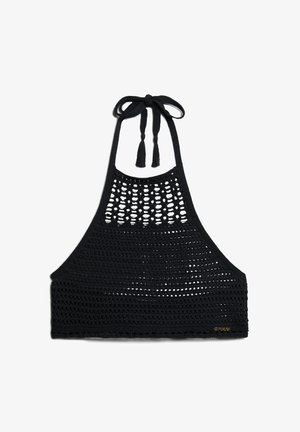 Haut halter en crochet noir avec un design à mailles ouvertes, un col réglable à nouer avec des franges, et des détails de parement solide.