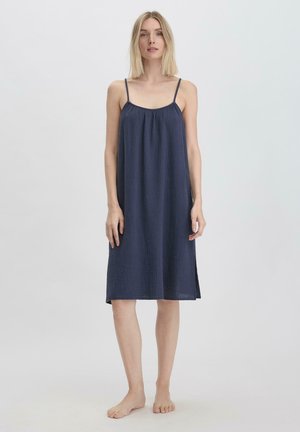Abito senza maniche blu navy in tessuto leggero e testurizzato. Presenta una vestibilità ampia, spalline regolabili e un design fino al ginocchio.
