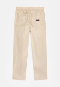 Tommy Hilfiger MONOTYPE SKATER PANT - Trousers - classic beige