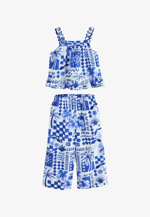 Top fără mâneci cu imprimeu tropical albastru și alb, cu volane, și pantaloni largi asortați cu talie elastică pentru copii.