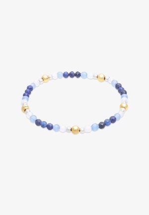 Bracelet extensible avec des perles alternées bleues, blanches, dorées et argentées disposées en un motif équilibré sur un fond blanc.