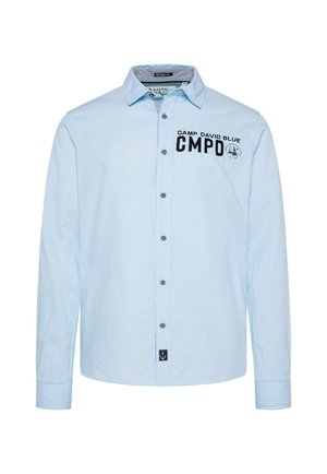Light blue long-sleeve shirt, buttoned front, features black embroidery reading "CAMP DAVID BLUE CMPD" on left chest, with anchor logo tag.