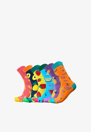 Calzini alla caviglia colorati con vari motivi di frutta: banane, ananas, fragole, angurie e altro ancora. Realizzati in tessuto morbido.