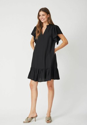 Black dress with short ruffled sleeves, V-neck, and a flared ruffled hem. Made of lightweight fabric, featuring two side pockets.