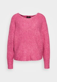 Pull rose tricoté avec un large col, des manches longues et une coupe décontractée. Tissu texturé avec un motif subtil sur toute la surface.