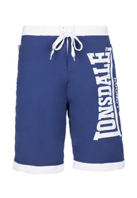 Blue swim shorts made of polyester with a white drawstring waistband, contrasting white hem, and large white "TONSDALE" logo on the side.