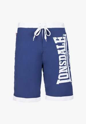 Blue swim shorts made of polyester with a white drawstring waistband, contrasting white hem, and large white "TONSDALE" logo on the side.