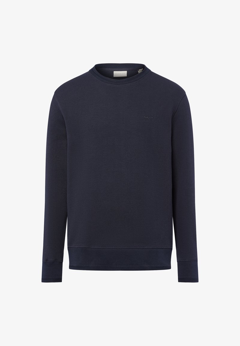 Marineblaue Langarm-Pullover im Crewneck-Stil mit gerippten Bündchen und Saum, dezentes Logo auf der linken Brust gestickt.