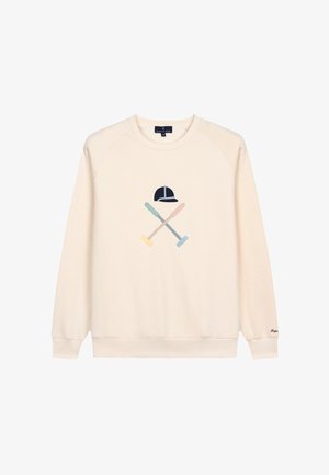 Cremfarbener Pullover mit Raglanärmeln, der ein Grafikdesign von gekreuzten Mallets und einer Kappe in sanften Pastellfarben zeigt.