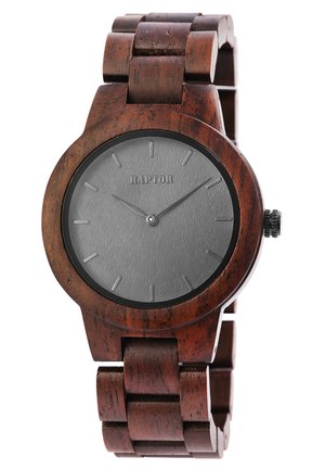 Holzuhr mit einem dunkelbraunen Armband, runder Gehäuseform und einem metallic silbernen Zifferblatt. Besitzt minimale Stundenmarkierungen und eine strukturierte Oberfläche.