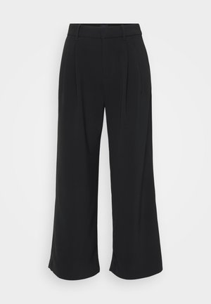 Pantalones de pierna ancha negros hechos de una tela suave, con una cintura ajustada, pliegues y una silueta fluida.