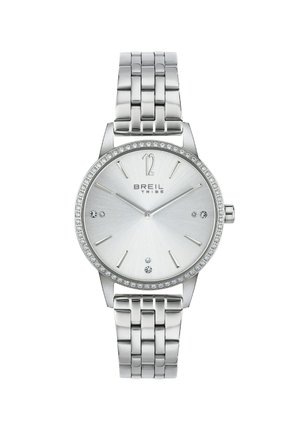 Sølv rustfrit stål ur med en glat, lys sølvskive, en krystalbesat bezel og et metalledarmbånd.