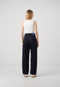 HUGO GETARA B - Wide leg - navy