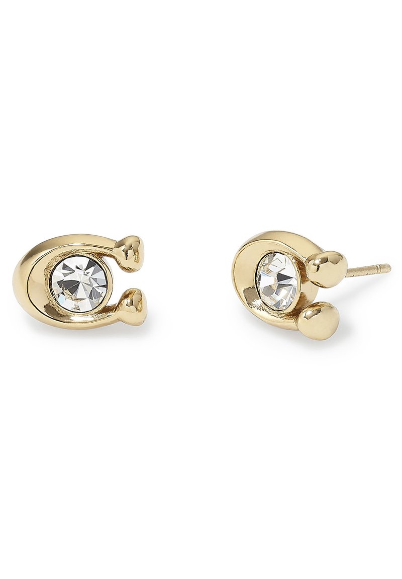 Pendientes de stud en tono dorado con un diseño circular que presenta un brillante claro en el centro, acentuado por dos pequeños elementos esféricos.