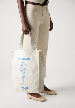 Canvas tote bag in light beige, featuring a blue ice cream cone graphic and text "ICE CREAM PLEASE." Straight handles and spacious design.