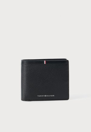 Black leather wallet with a textured finish. Features a small red, white, and blue accent stripe and the "TOMMY HILFIGER" logo. Folded design.