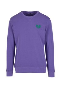 Purpursvārks, kas izgatavots no kokvilnas, ar apaļu kaklu un garām piedurknēm. Ievērojams zaļš logotips kreisajā krūtīs un ribota aproce.