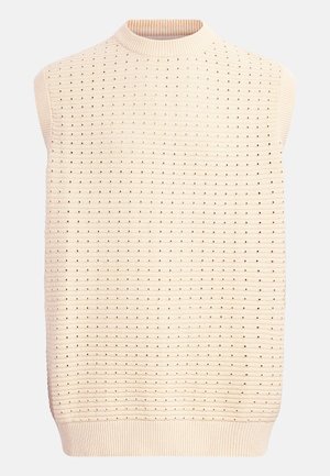 Μπεζ βελουτέ γιλέκο χωρίς μανίκια με οριζόντιο ριμπ ύφασμα και μικρές οπές παντού, με ριμπ λαιμόκοψη και τελείωμα.