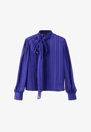 Camicia viola trasparente con righe verticali, dettaglio al collo annodato, maniche lunghe a sbuffo e polsini con bottoni. Tessuto liscio e vestibilità ampia.