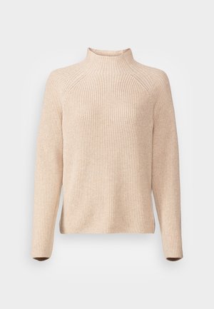 Beige knitted sweater with a high collar, long sleeves, ribbed texture, and side slits at the hem for a relaxed fit.