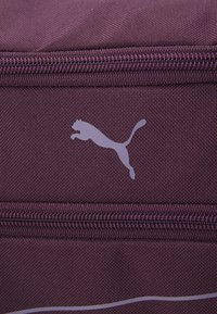 Puma FUNDAMENTALS BAG XS UNISEX - Športna torba - midnight plum