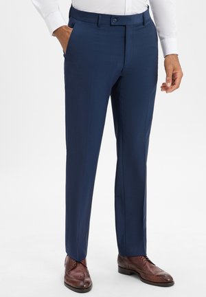 Navy dress trousers made of smooth fabric, featuring a flat front, belt loops, and side pockets, paired with brown lace-up shoes.