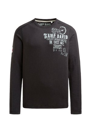 Black long-sleeve sweatshirt with a crew neck, featuring white graphic text and designs on the front, made from a soft, textured fabric.
