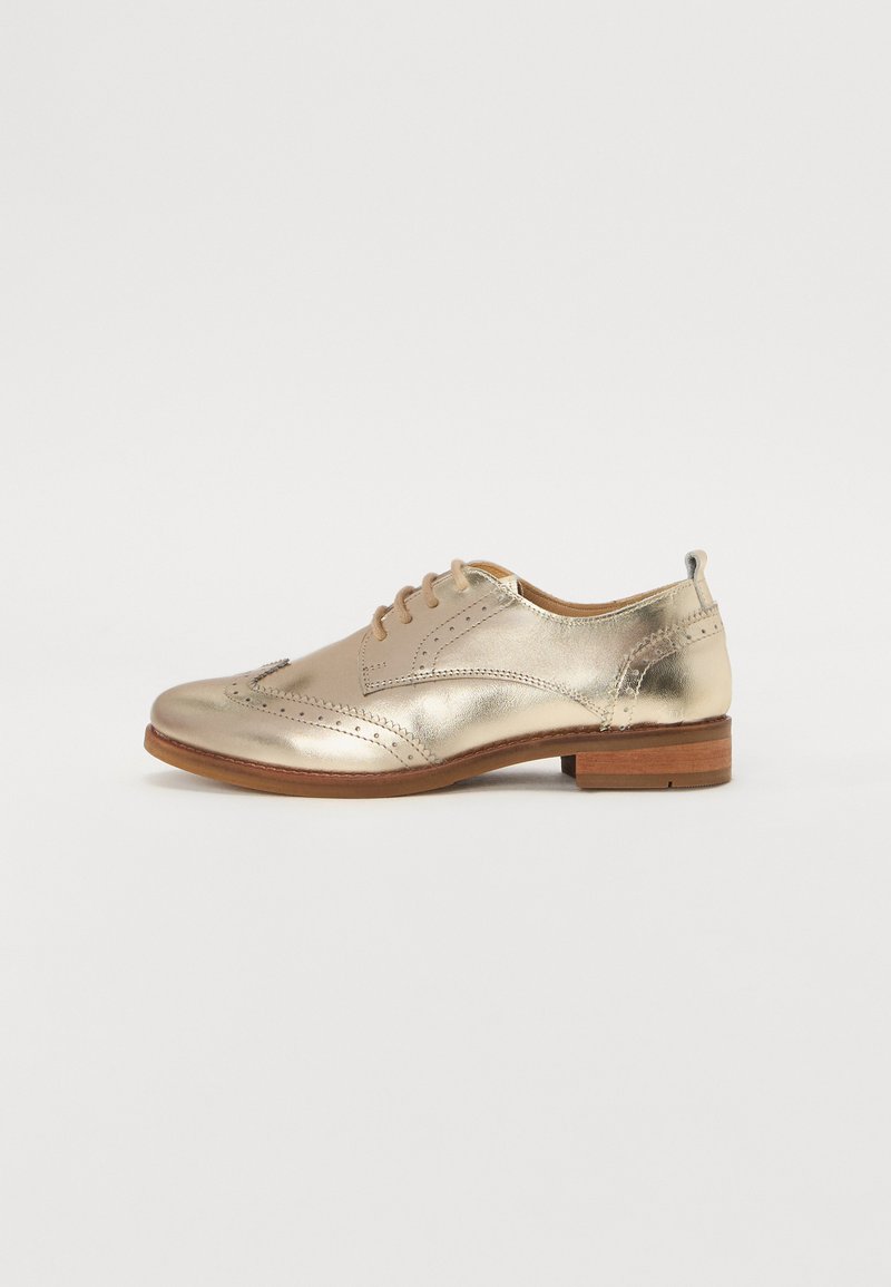 Gold metallic oxford shoe with a rounded toe, smooth leather texture, decorative perforations, and a low wooden heel.