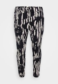 Černobílé abstraktní vzorované slim-fit kalhoty s elastickým pasem a černou šňůrkou na světlem pozadí.