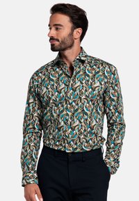 Geprint overhemd met een mix van groene, blauwe en bruine bladeren met cirkelvormige accenten; met knoopkraag; lange mouwen; van katoen.