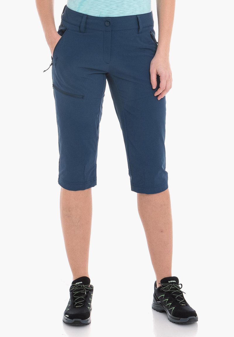 Pantalones cortos de rodilla en azul marino, hechos de una tela ligera, con un bolsillo con cremallera en el lateral y una cintura ajustada.