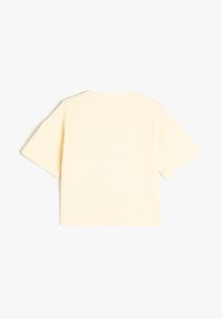 Kortærmet, oversized t-shirt i lys gul, lavet af ribbet stof. Har en rund halsudskæring og ingen synlige mønstre eller accenter.
