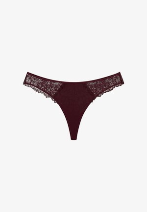 Burgundy thong with lace detailing on the sides. Smooth fabric with scalloped lace edges, featuring a minimalistic design.