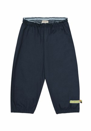 Marineblaue Kinderhose aus weichem Stoff mit elastischem Bund und umgenähten Säumen. Enthält ein kleines, mehrfarbiges Etikett an der Seite.