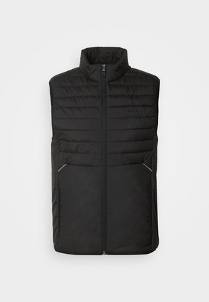 Zwarte puffer gilet met hoge kraag, ritssluiting aan de voorkant, twee zijzakken, gewatteerd ontwerp en een gladde textuur. Opmerkelijke zilveren accenten op de zakken.