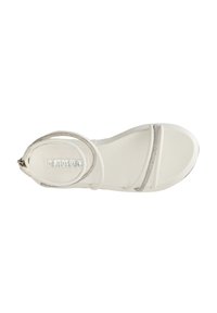 White flat sandal with two narrow straps and a circular buckle. Features a smooth texture and a subtle metallic accent. Lightweight design.