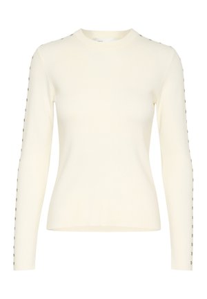 Krem pulover z dolgimi rokavi v oprijetem dizajnu, z okroglo izrezom in dekorativnimi kovinskimi gumbi ob rokavih. Gladka tekstura.