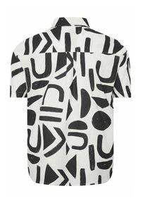 Chemise blanche à manches courtes avec un motif abstrait de formes géométriques noires, comprenant des cercles, des triangles et des lignes, vue de dos.