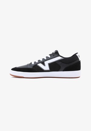 Black sneaker with white accents, featuring a smooth leather and mesh upper, rounded toe, and rubber sole with a gum sole for grip.